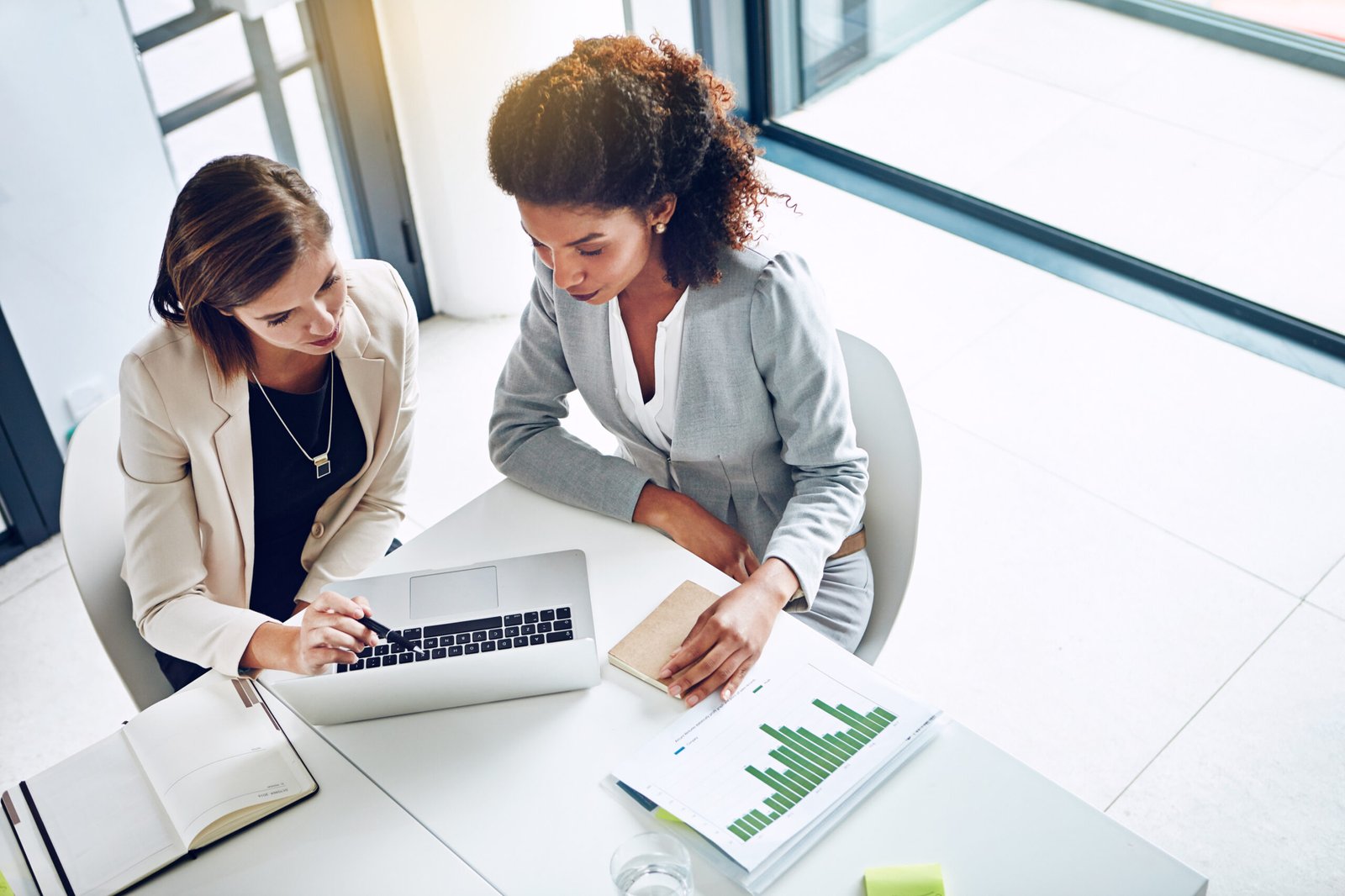 computer-paperwork-women-office-together-research-teamwork-partnership-strategy-planning-business-people-with-laptop-stats-graphs-charts-data-analysis-from